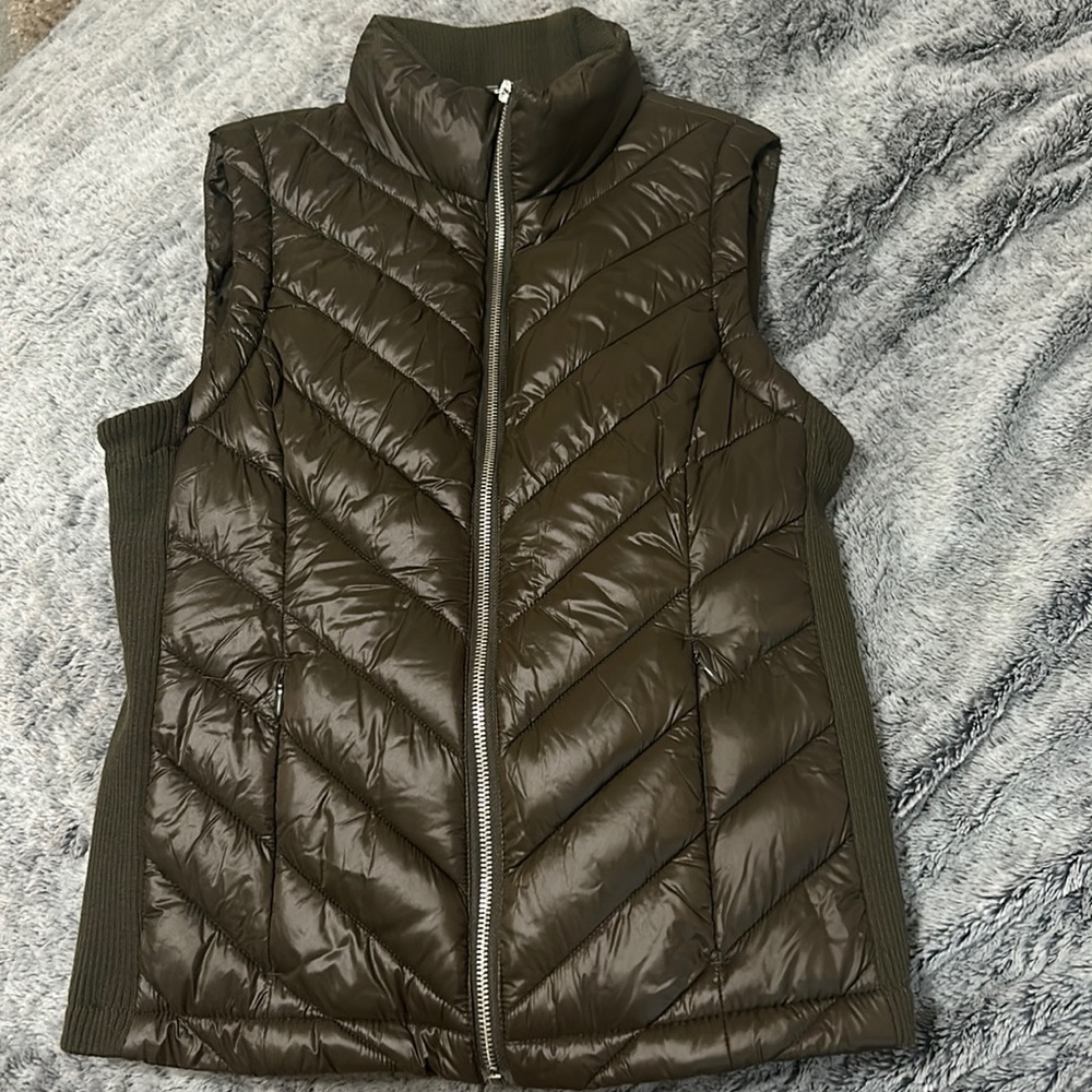 A green olive vest. Maybe for the fall time or even winter for an extra layer.